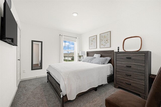 carpeted bedroom with baseboards and recessed lighting