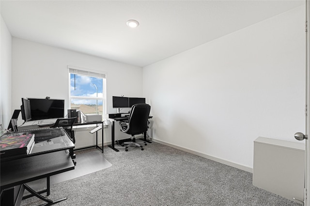 carpeted office space with baseboards