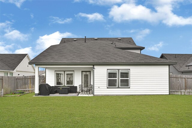 rear view of property with a fenced backyard, an outdoor hangout area, a shingled roof, a patio area, and a lawn