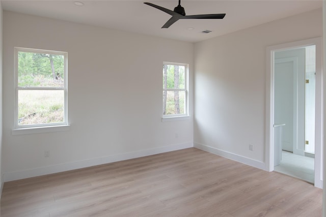 100 Mahalo Ct, Bastrop, TX 78602 - empty room featuring light wood-type flooring, ceiling fan, and baseboards