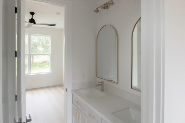 100 Mahalo Ct, Bastrop, TX 78602 - bathroom with double vanity, a ceiling fan, and baseboards
