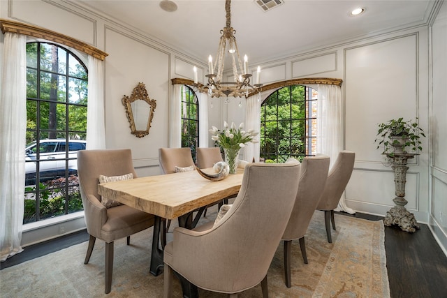 11519 Shadow Way St, Houston, TX 77024 - dining area with an inviting chandelier, a decorative wall, recessed lighting, wood finished floors, and visible vents