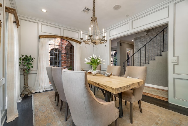 11519 Shadow Way St, Houston, TX 77024 - dining room featuring stairs, a chandelier, wood finished floors, and visible vents