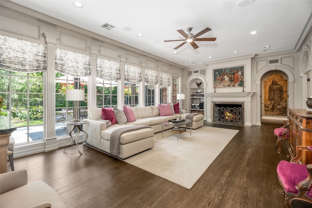 11519 Shadow Way St, Houston, TX 77024 - living area featuring crown molding, ceiling fan, a lit fireplace, and visible vents