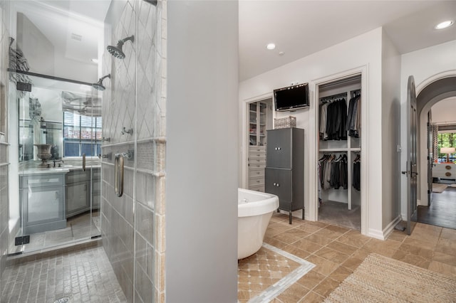 11519 Shadow Way St, Houston, TX 77024 - full bathroom with a freestanding tub, a walk in closet, and a stall shower