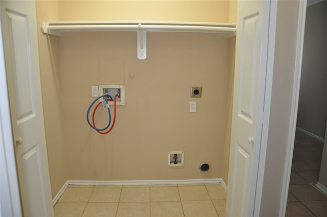 washroom with hookup for a gas dryer, laundry area, electric dryer hookup, hookup for a washing machine, and baseboards