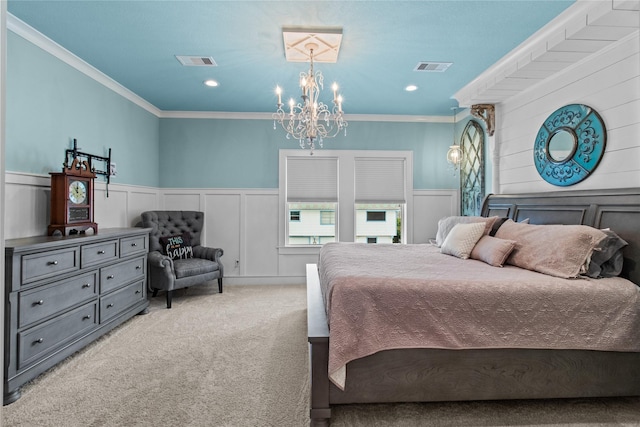 carpeted bedroom with an inviting chandelier, visible vents, crown molding, and a decorative wall