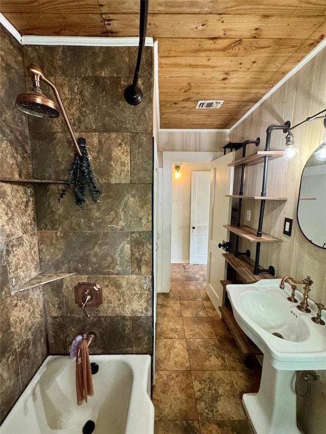 bathroom featuring stone finish flooring, visible vents, ornamental molding, and wooden ceiling