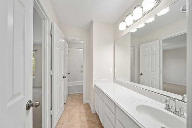 full bath with shower / bathing tub combination, vanity, tile patterned flooring, and baseboards