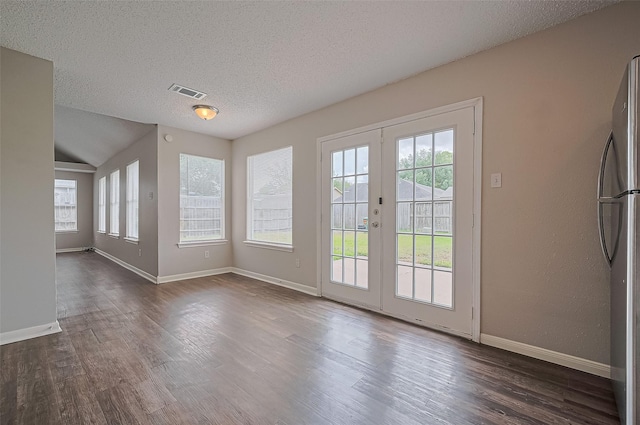 23931 Griffin House Ln, Katy, TX 77493 - doorway to outside featuring a textured ceiling, visible vents, baseboards, dark wood-style flooring, and french doors