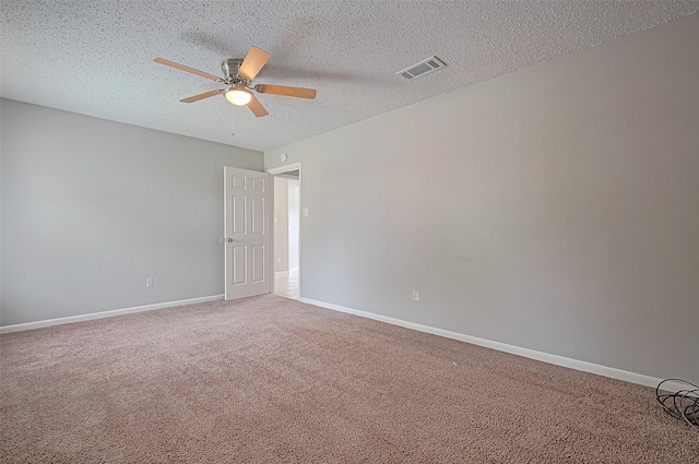 23931 Griffin House Ln, Katy, TX 77493 - carpeted spare room featuring baseboards, visible vents, a ceiling fan, and a textured ceiling