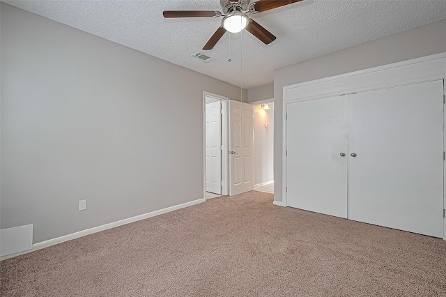 23931 Griffin House Ln, Katy, TX 77493 - unfurnished bedroom featuring a closet, ceiling fan, visible vents, a textured ceiling, and carpet floors