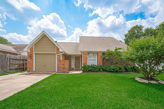 23931 Griffin House Ln, Katy, TX 77493 - ranch-style house featuring fence, a garage, driveway, and brick siding