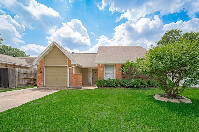 23931 Griffin House Ln, Katy, TX 77493 - ranch-style home featuring a front yard, driveway, fence, and brick siding