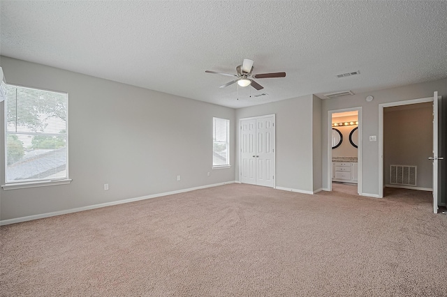 23931 Griffin House Ln, Katy, TX 77493 - unfurnished bedroom with a textured ceiling, visible vents, and light colored carpet
