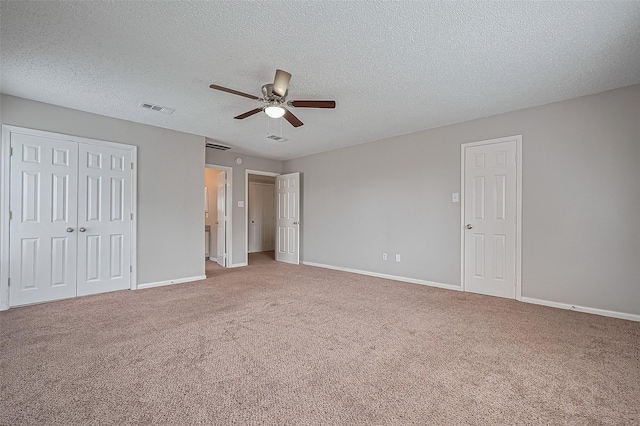 23931 Griffin House Ln, Katy, TX 77493 - unfurnished bedroom with a textured ceiling, visible vents, carpet flooring, and baseboards