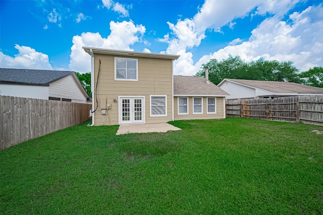 23931 Griffin House Ln, Katy, TX 77493 - rear view of property featuring french doors, a fenced backyard, a patio area, and a lawn