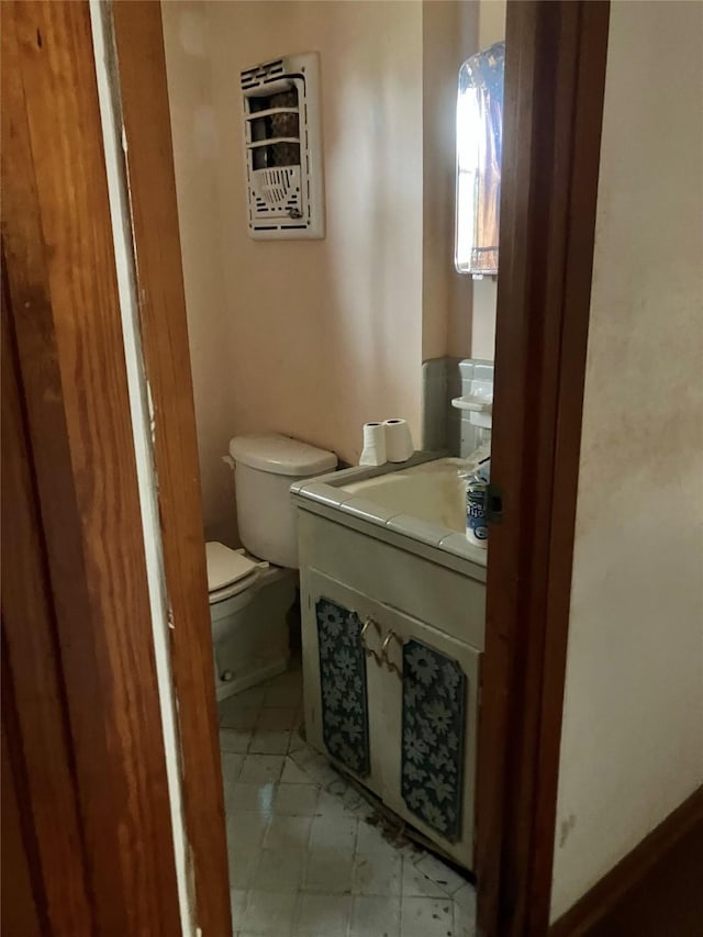 bathroom with toilet and vanity