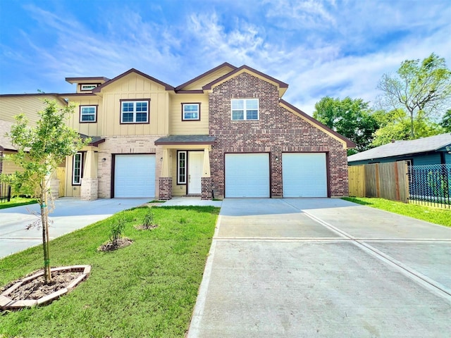 5602 Hirondel St A/B, Unit A/B Houston, TX 77033 - view of front of home featuring concrete driveway, a front yard, brick siding, and fence