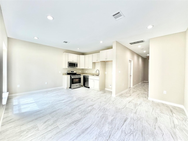 5602 Hirondel St A/B, Unit A/B Houston, TX 77033 - kitchen with a sink, appliances with stainless steel finishes, open floor plan, and visible vents
