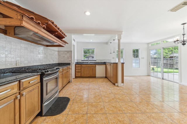 kitchen featuring white dishwasher, a wealth of natural light, visible vents, and gas range