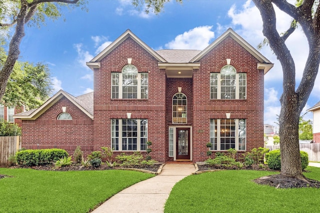 4406 Tarlton Way, Sugar Land, TX 77478 - colonial home with brick siding and a shingled roof