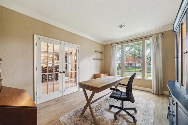 4406 Tarlton Way, Sugar Land, TX 77478 - office area with french doors, a textured wall, ornamental molding, light wood-style flooring, and a textured ceiling