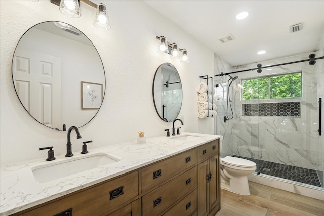 4406 Tarlton Way, Sugar Land, TX 77478 - bathroom with toilet, a marble finish shower, wood finished floors, double vanity, and recessed lighting