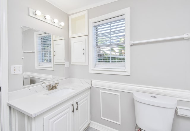 half bathroom featuring toilet and vanity