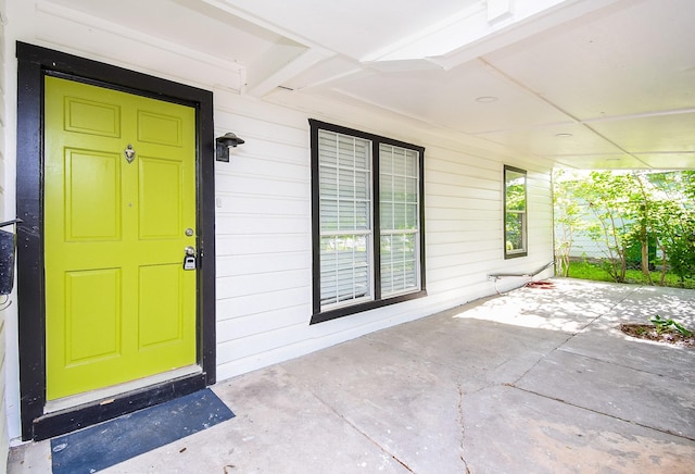 doorway to property featuring a porch