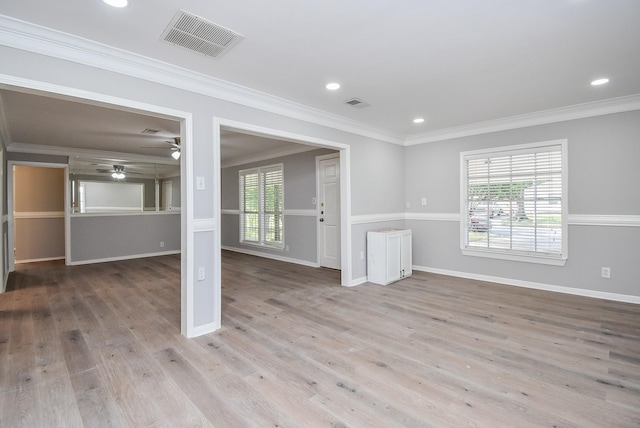 unfurnished living room featuring visible vents, ceiling fan, wood finished floors, and baseboards