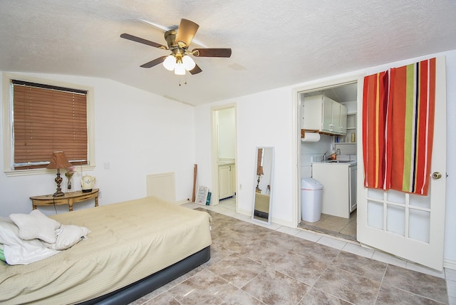 bedroom with connected bathroom, light tile patterned floors, ceiling fan, a textured ceiling, and lofted ceiling