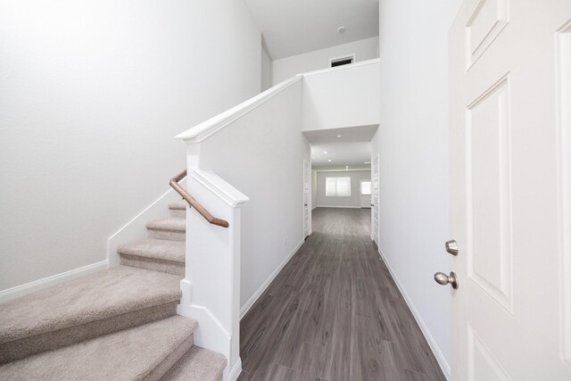 8113 Burnt Orchid Dr, Houston, TX 77016 - stairway featuring baseboards and wood finished floors