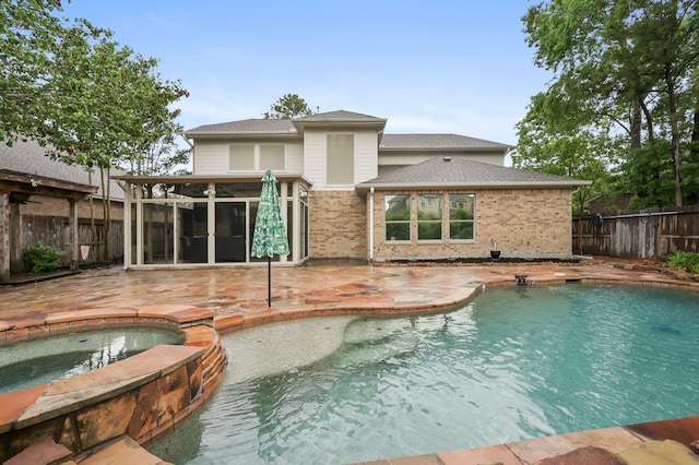 2218 Dawn Wind Ln, Spring, TX 77386 - view of pool featuring an in-ground hot tub, a fenced backyard, a sunroom, and a patio area