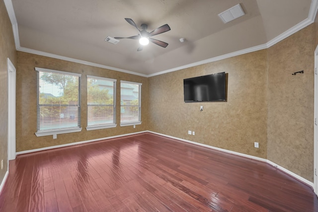 empty room featuring visible vents, ceiling fan, and hardwood / wood-style floors