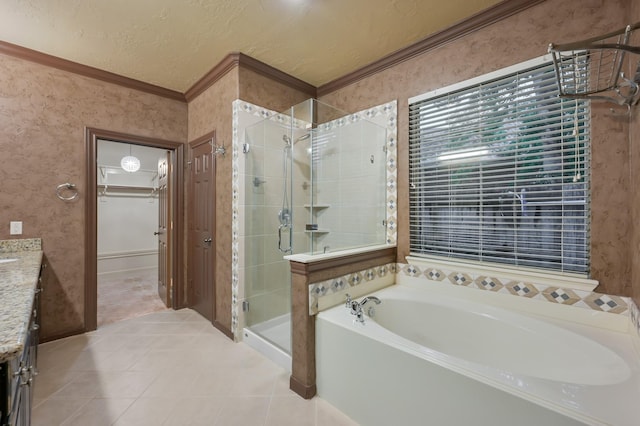 full bath featuring vanity, crown molding, a garden tub, tile patterned floors, and a shower stall