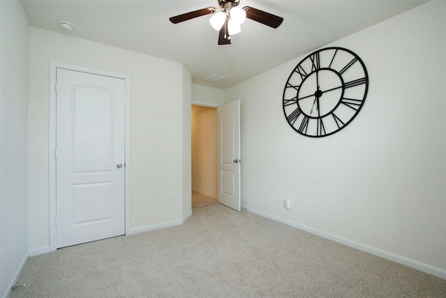 unfurnished bedroom with baseboards, carpet, and ceiling fan
