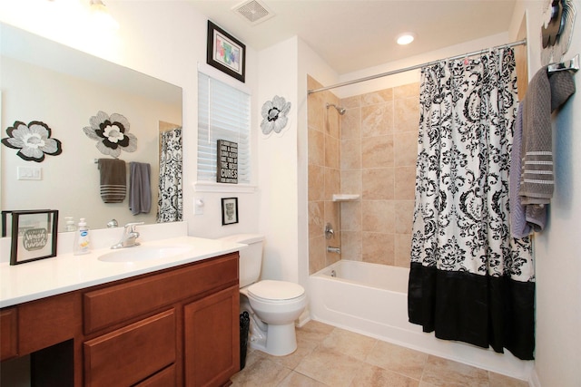 full bath with shower / bath combination with curtain, visible vents, vanity, tile patterned floors, and toilet