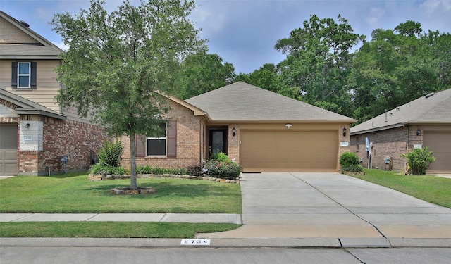 view of front of home with an attached garage, concrete driveway, a front yard, and brick siding