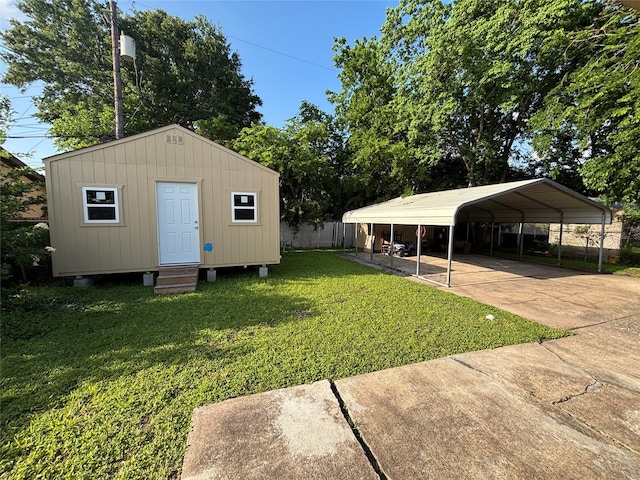 exterior space featuring concrete driveway, a carport, entry steps, and fence
