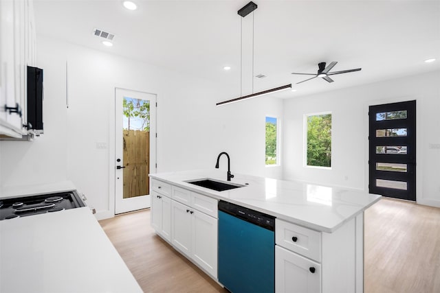 kitchen featuring recessed lighting, light wood-style floors, ceiling fan, a sink, and dishwashing machine