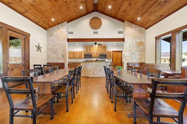 dining area with wood ceiling, ceiling fan, visible vents, decorative columns, and high vaulted ceiling