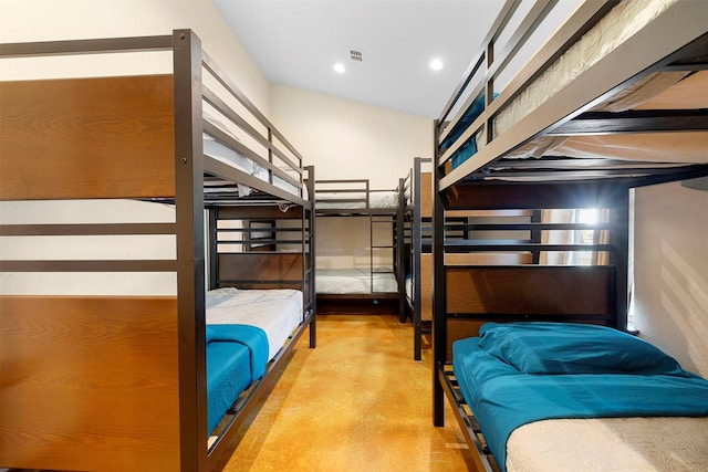 bedroom featuring finished concrete flooring, visible vents, and recessed lighting