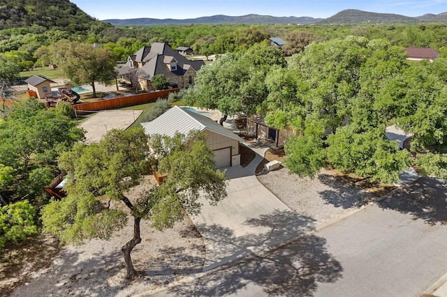 aerial view with a mountain view and a view of trees