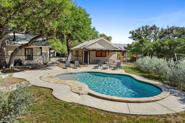 view of pool featuring a patio, fence, and a fenced in pool