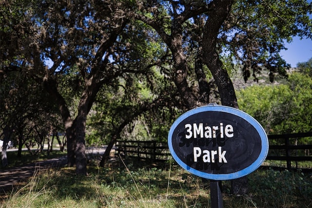 community sign with fence
