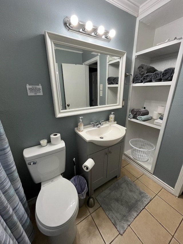 full bathroom with tile patterned floors, vanity, toilet, and ornamental molding