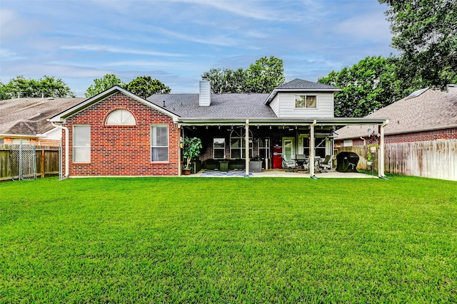 939 Legend Spring Dr, Katy, TX 77494 - back of house with a yard, a patio area, and a fenced backyard