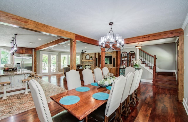 dining area featuring a chandelier, baseboards, dark wood-type flooring, beamed ceiling, and stairway