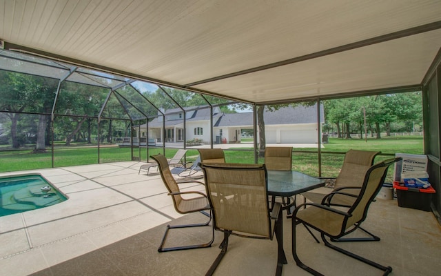 view of patio featuring a lanai, outdoor dining space, and an outdoor pool